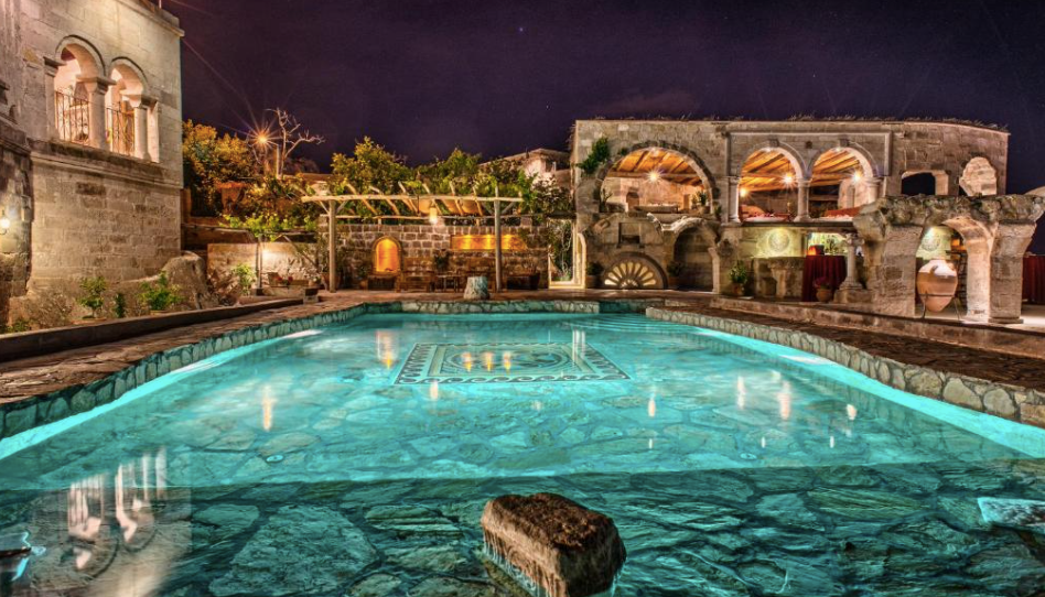 Romantic luxury cave suite in Cappadocia with stone walls and cozy lighting